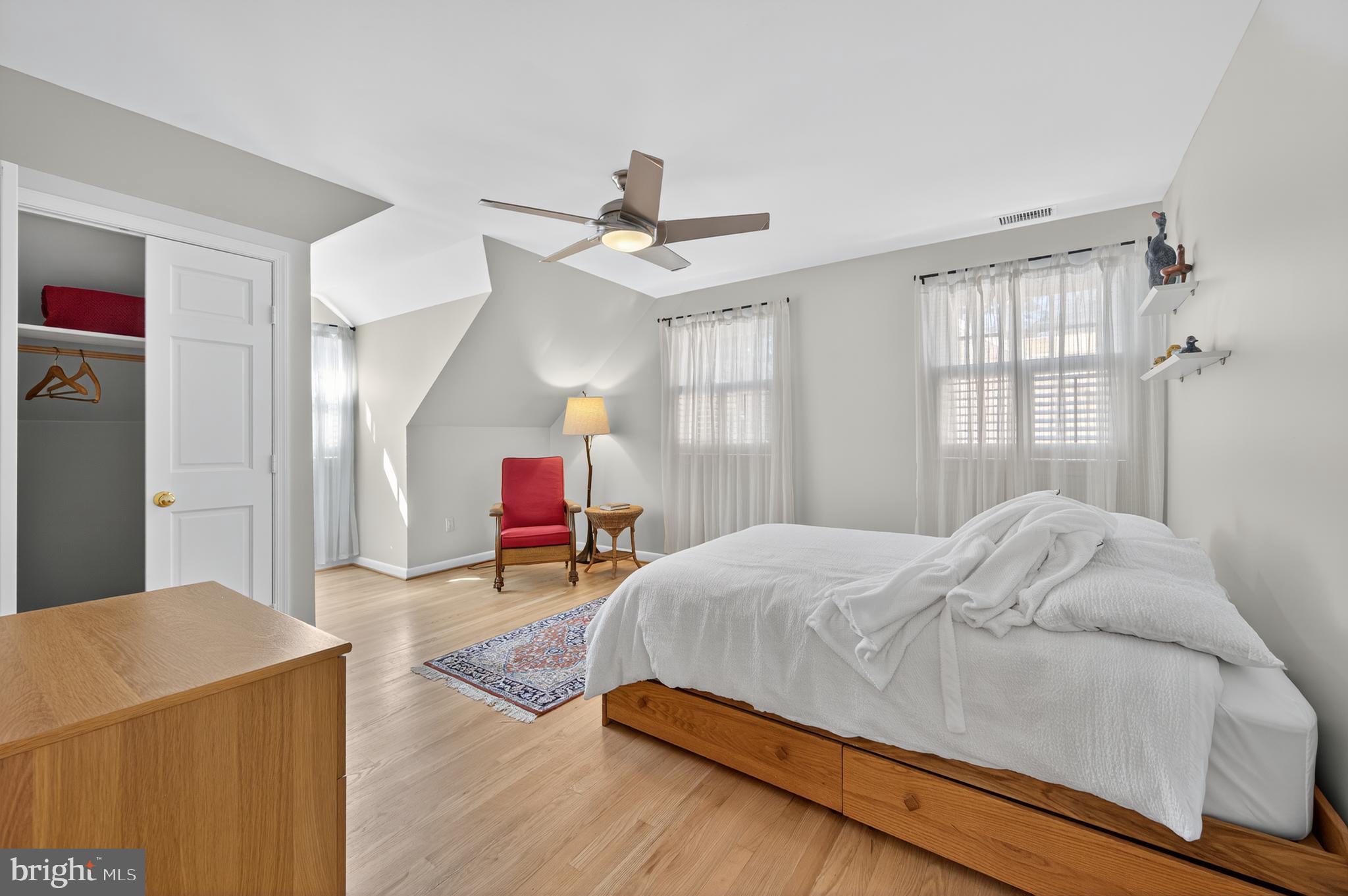 3137 Aberfoyle Place Northwest Washington, DC 20015 - Photo 50 of 85 a bedroom with a bed and a chandelier