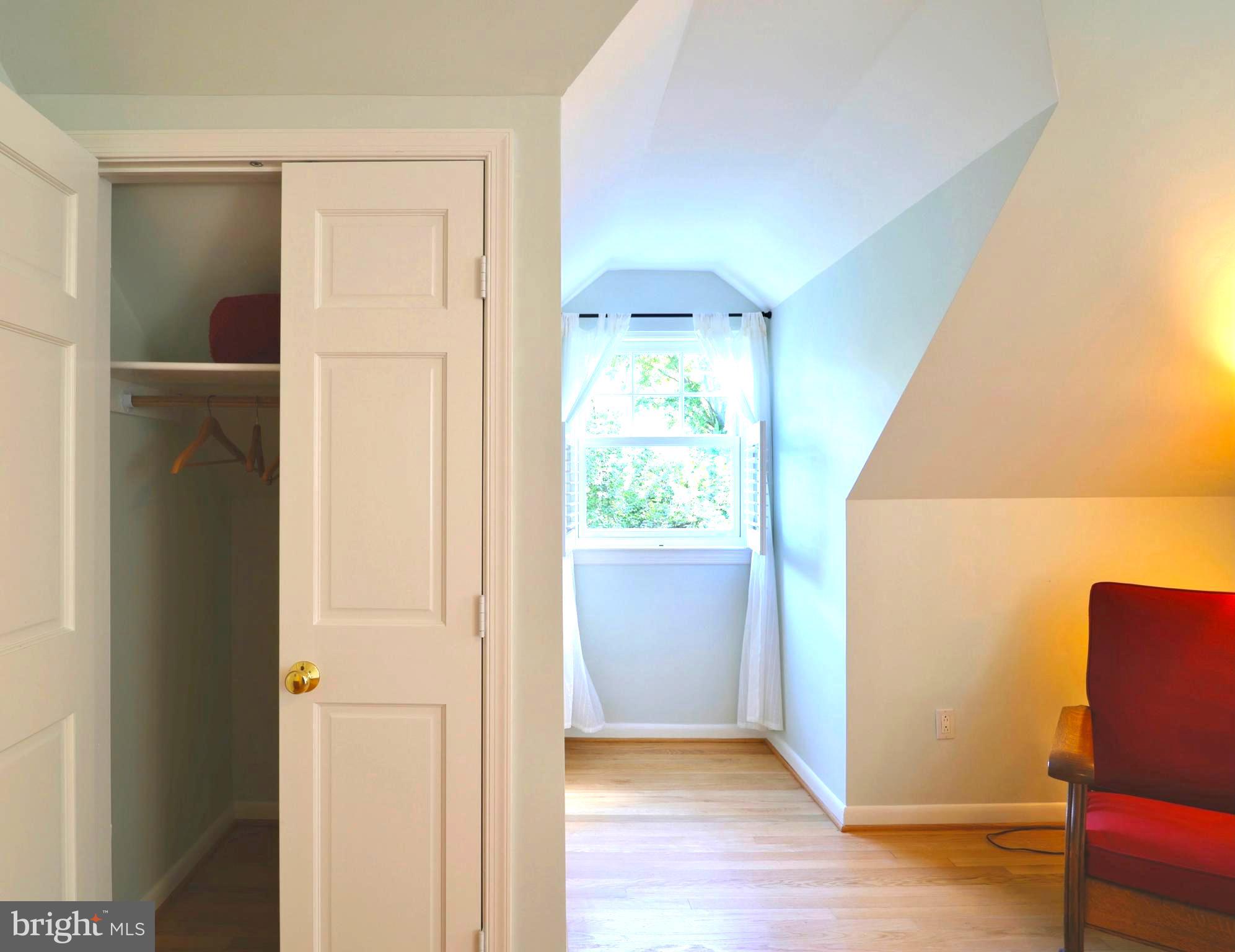 3137 Aberfoyle Place Northwest Washington, DC 20015 - Photo 52 of 85 an empty room with wooden floor closet and windows