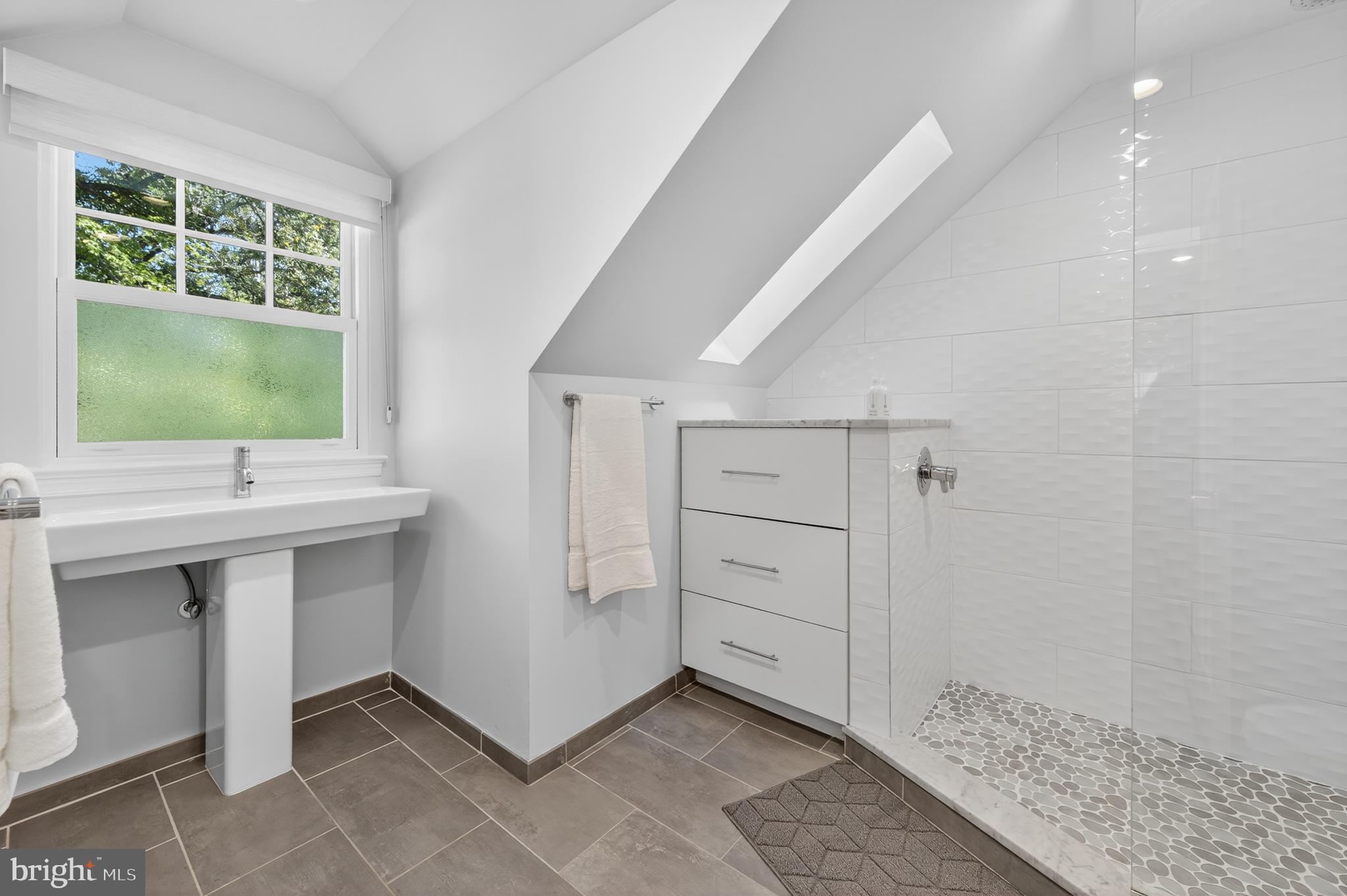 3137 Aberfoyle Place Northwest Washington, DC 20015 - Photo 55 of 85 a bathroom with a sink and a mirror