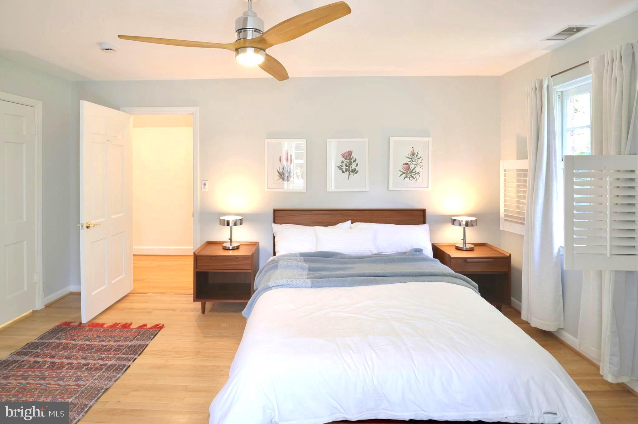 3137 Aberfoyle Place Northwest Washington, DC 20015 - Photo 60 of 85 a bedroom with a large bed and a couch