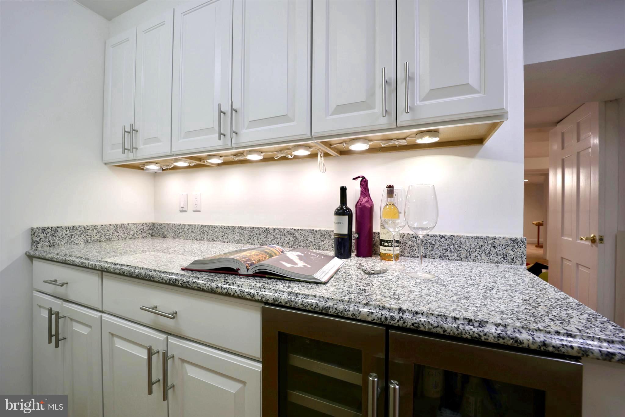 3137 Aberfoyle Place Northwest Washington, DC 20015 - Photo 64 of 85 a kitchen with granite countertop cabinets and stainless steel appliances