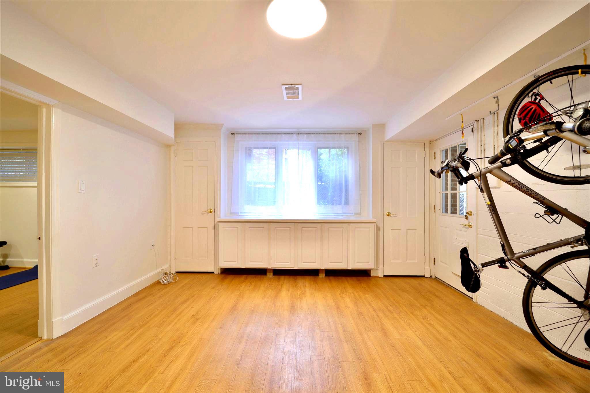 3137 Aberfoyle Place Northwest Washington, DC 20015 - Photo 66 of 85 a view of a room with gym equipment and a window