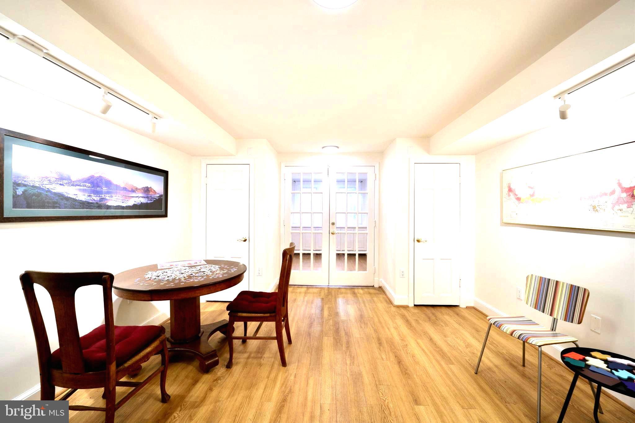 3137 Aberfoyle Place Northwest Washington, DC 20015 - Photo 73 of 85 a view of a dining room with furniture and wooden floor