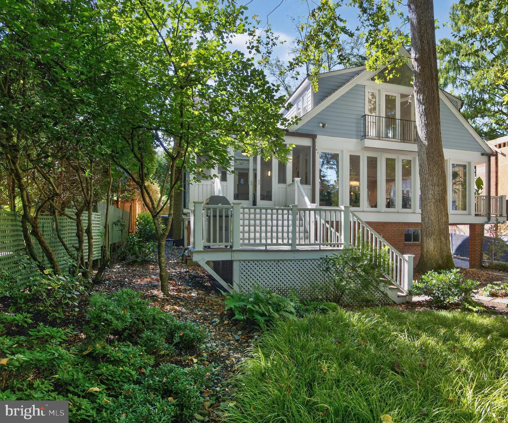 3137 Aberfoyle Place Northwest Washington, DC 20015 - Photo 83 of 85 a view of a house with a yard and potted plants