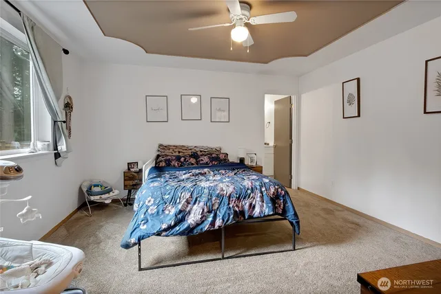 a bedroom with a bed and window