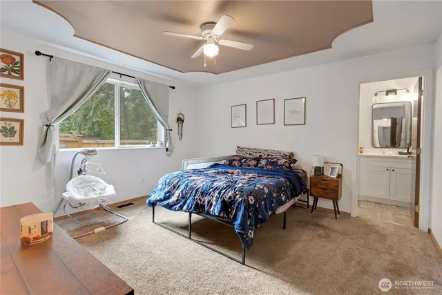 a living room with a bed furniture and a window