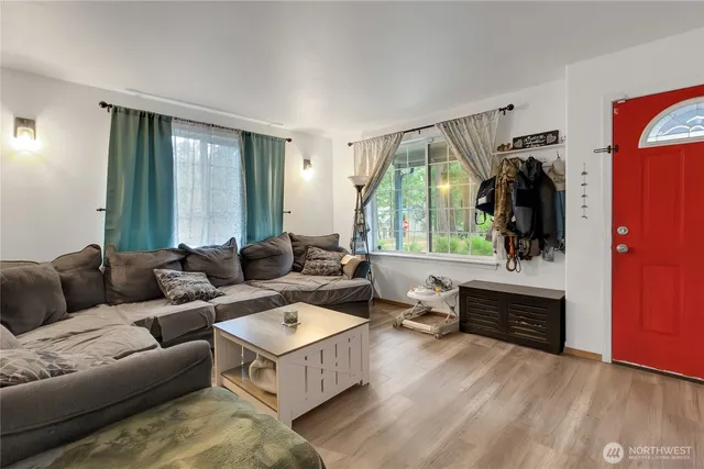 a living room with furniture and a window