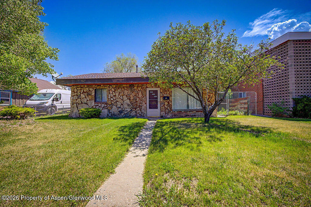 625 Russell Street Craig, CO 81625 - Photo 2 of 35 a front view of a house with garden