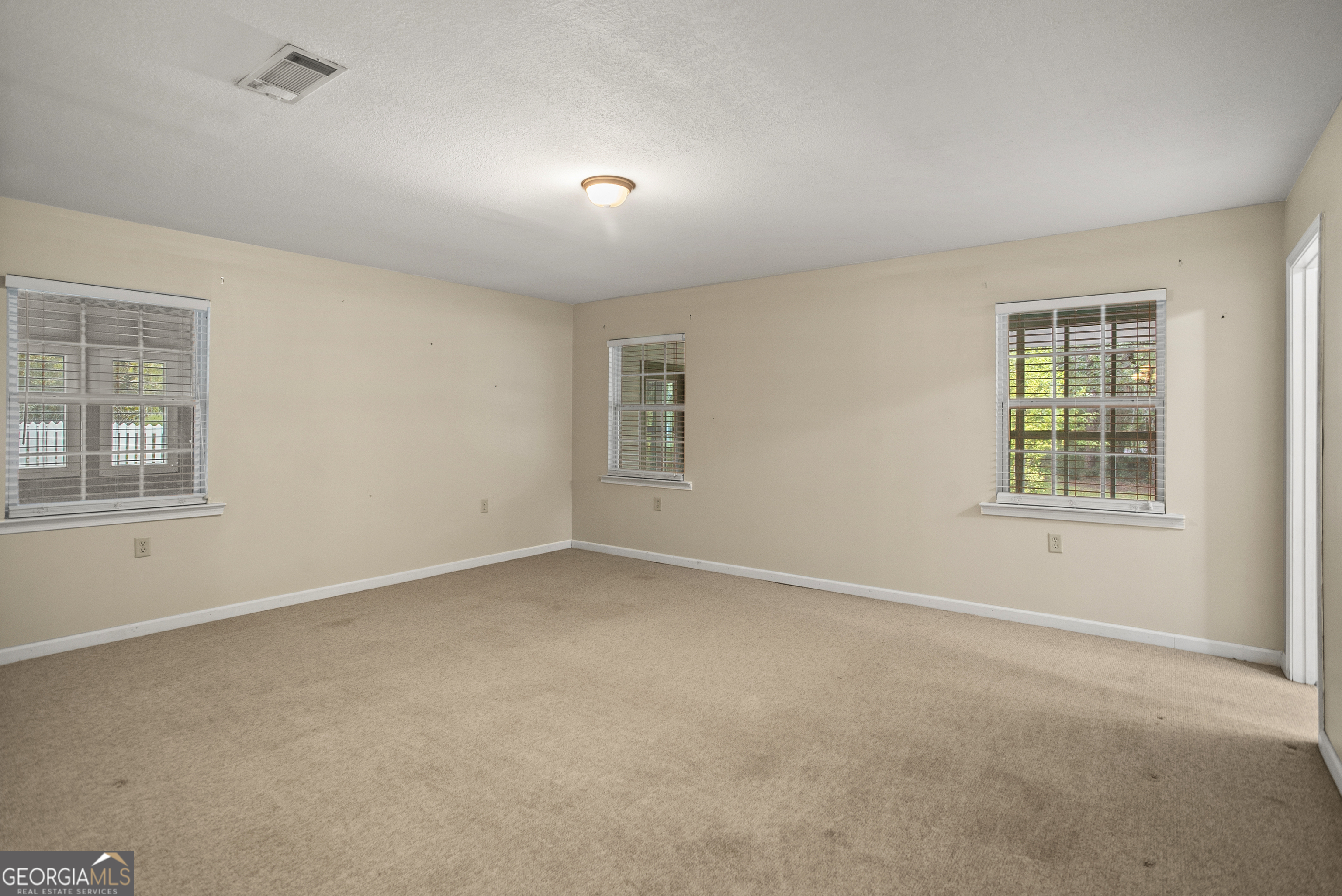 101 Ridge Drive Claxton, GA 30417 - Photo 15 of 30 an empty room with windows