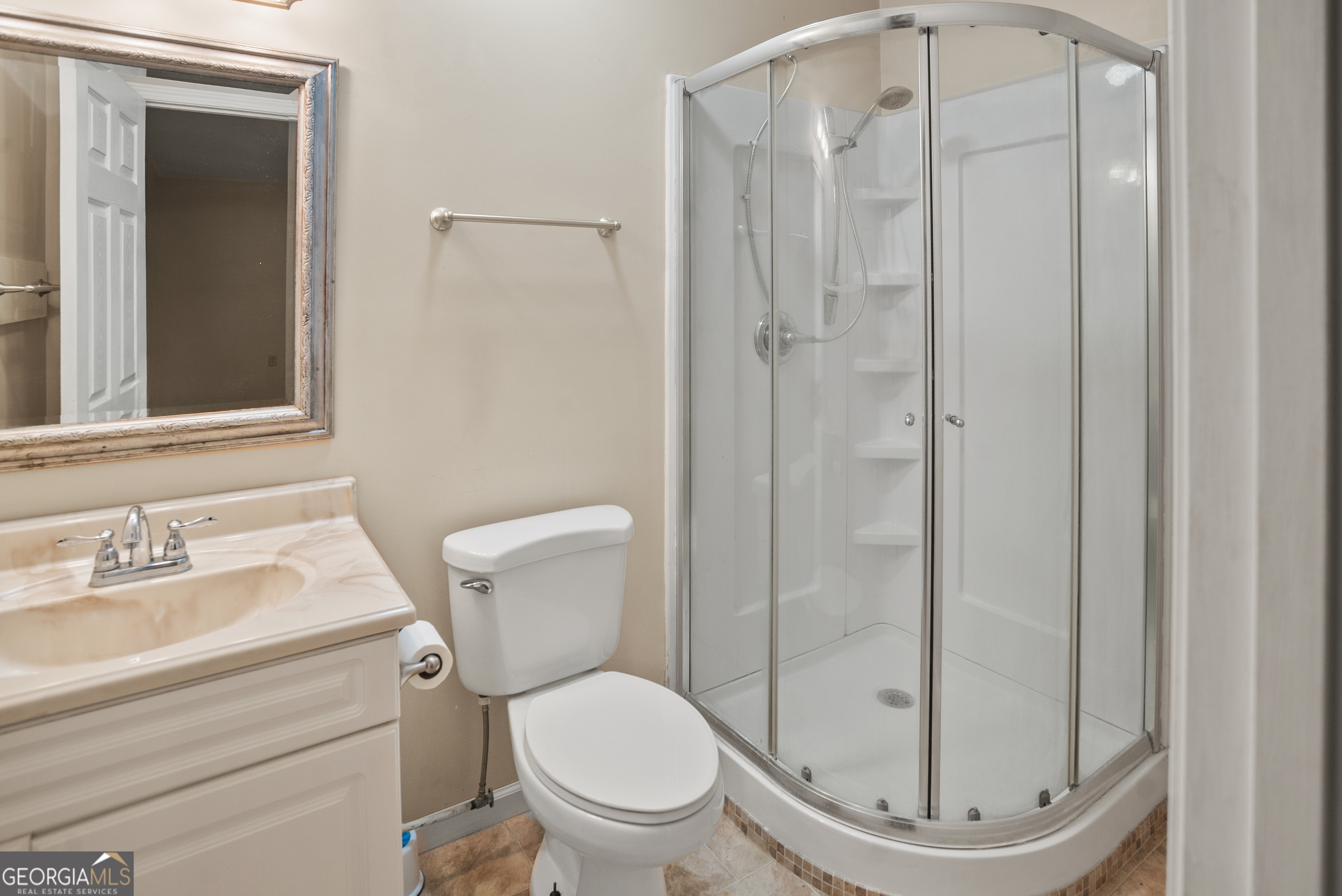 101 Ridge Drive Claxton, GA 30417 - Photo 17 of 30 a bathroom with a toilet and a shower