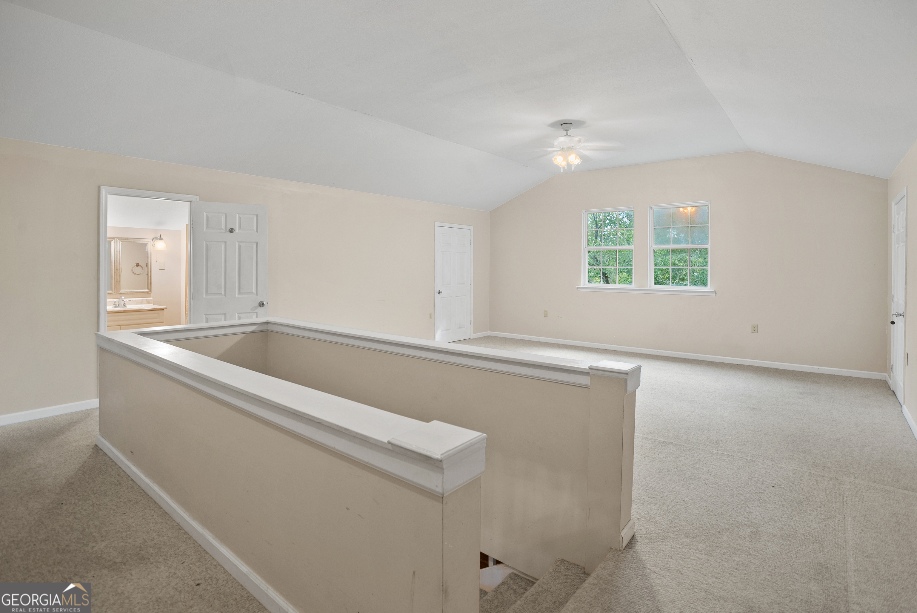 101 Ridge Drive Claxton, GA 30417 - Photo 20 of 30 an empty room with windows and ceiling fan