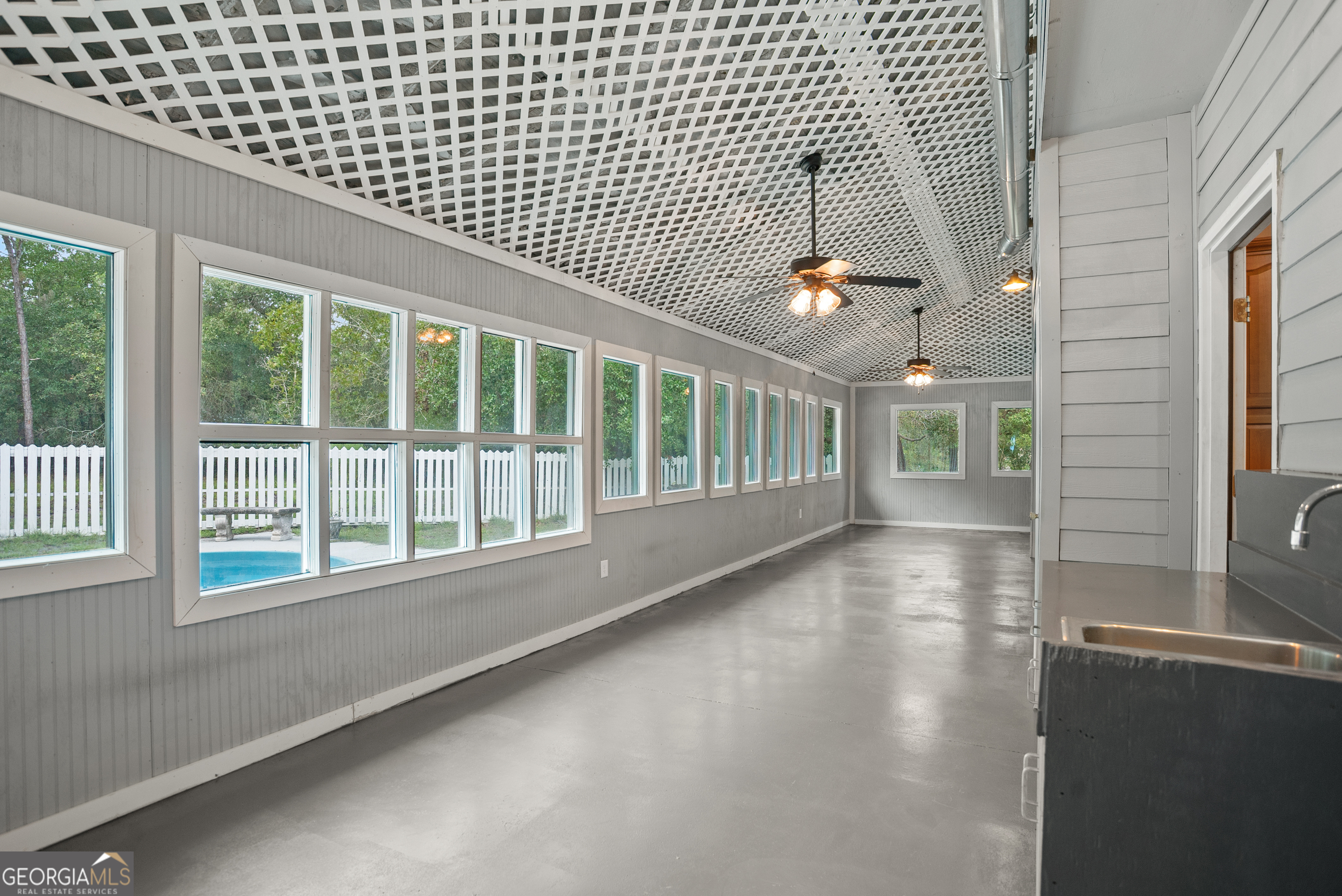 101 Ridge Drive Claxton, GA 30417 - Photo 25 of 30 a view of an empty room with wooden floor
