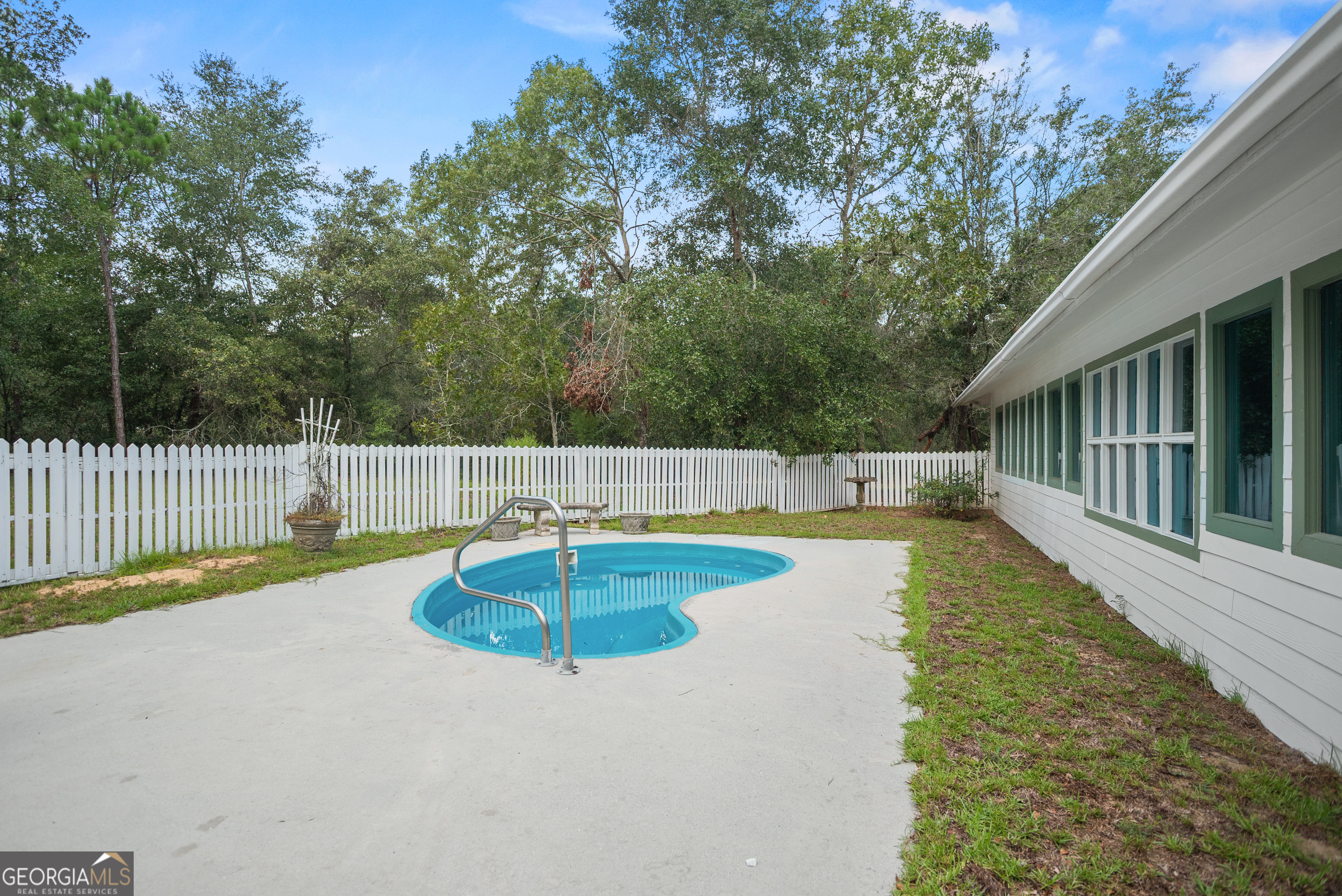 101 Ridge Drive Claxton, GA 30417 - Photo 29 of 30 a view of a swimming pool with a patio and a yard