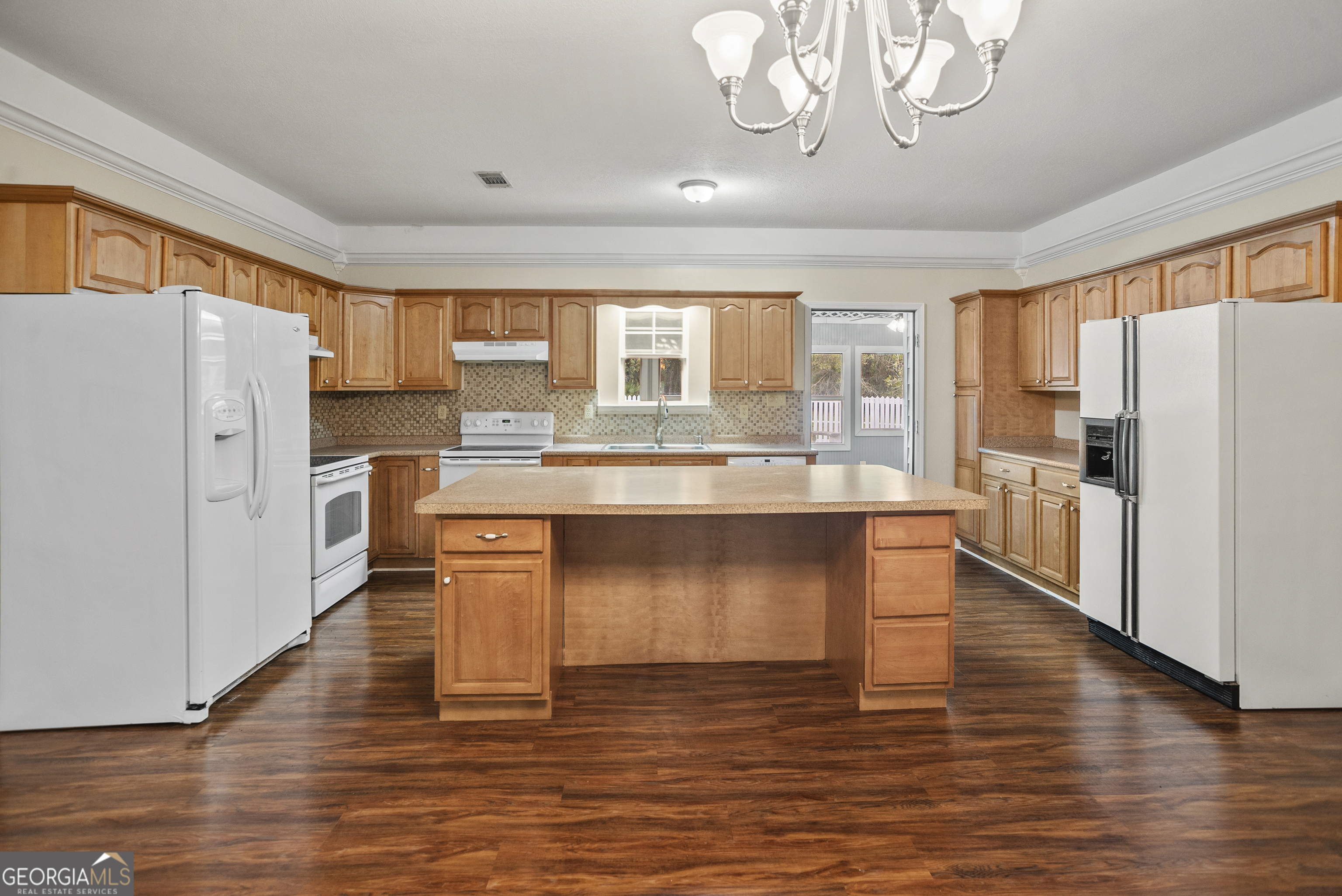 101 Ridge Drive Claxton, GA 30417 - Photo 6 of 30 a kitchen with stainless steel appliances granite countertop a refrigerator and a stove top oven