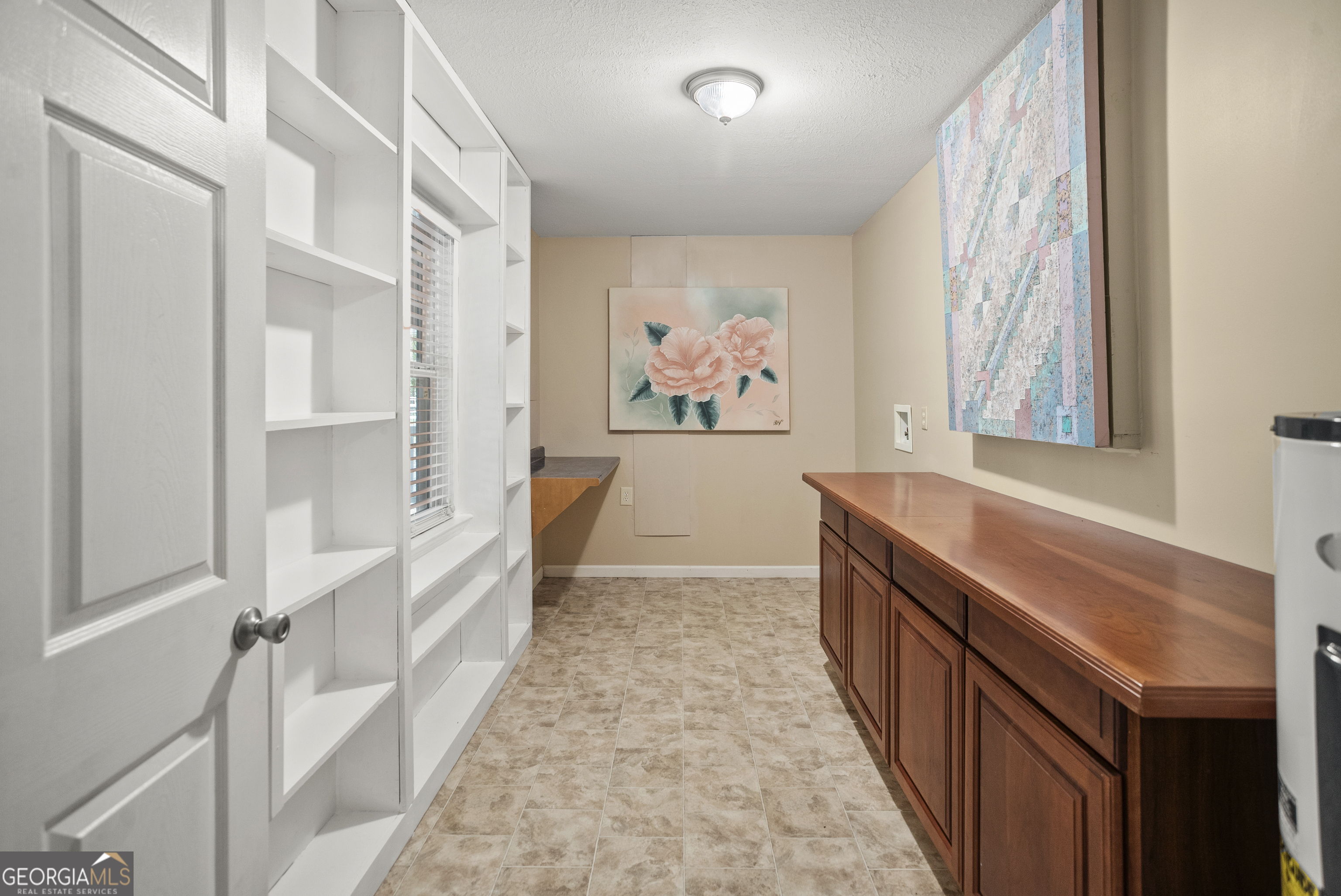 101 Ridge Drive Claxton, GA 30417 - Photo 8 of 30 a hallway with a large window and dresser