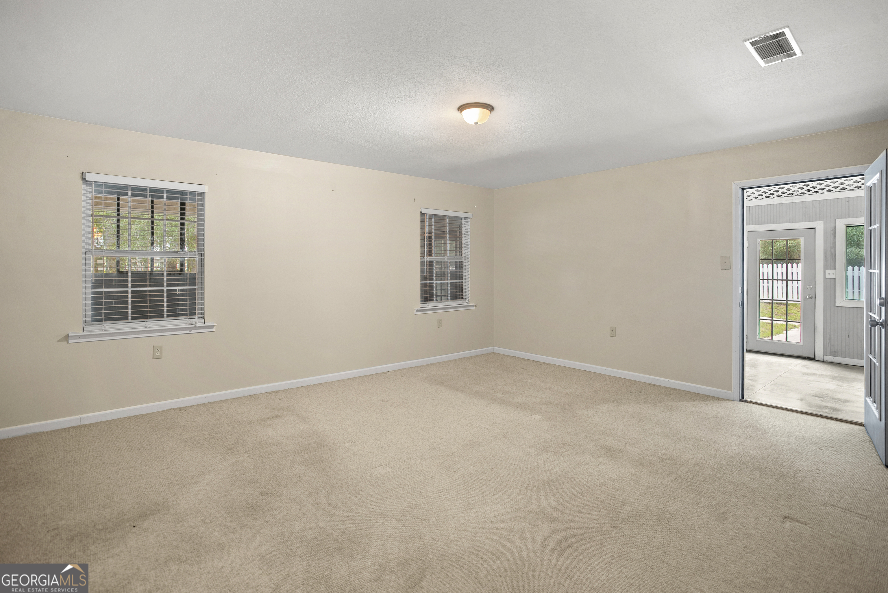 101 Ridge Drive Claxton, GA 30417 - Photo 9 of 30 a view of an empty room with a window