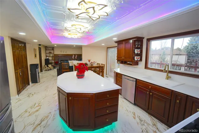 a kitchen with a sink stove and refrigerator