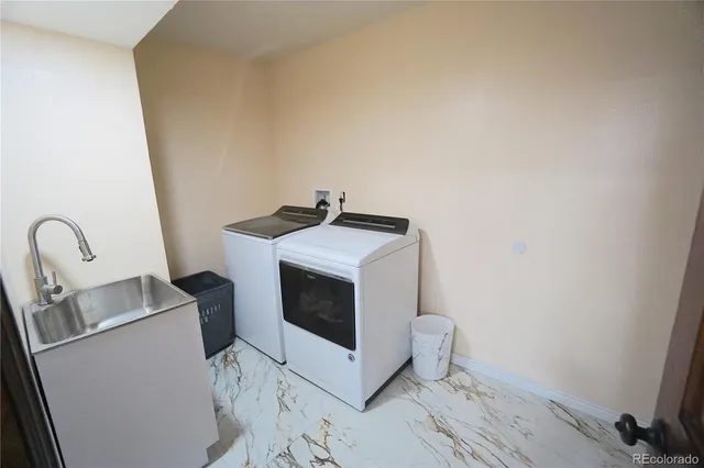 a utility room with dryer and washer
