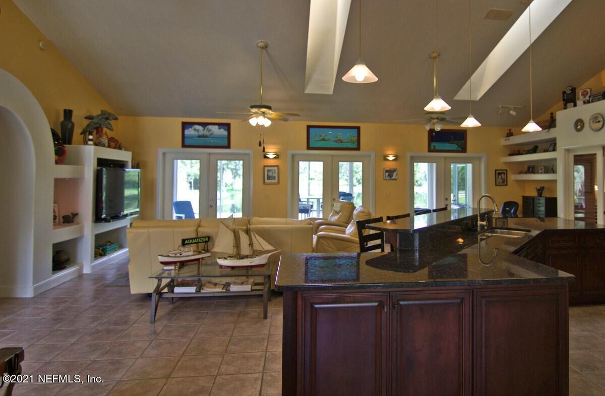 1365 Highway 206 St. Augustine, FL 32086 - Photo 11 of 54 a living room with lots of furniture and chandelier