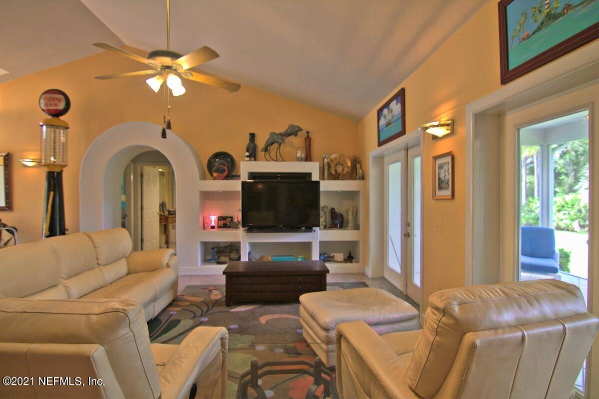1365 Highway 206 St. Augustine, FL 32086 - Photo 13 of 54 a living room with furniture and a flat screen tv