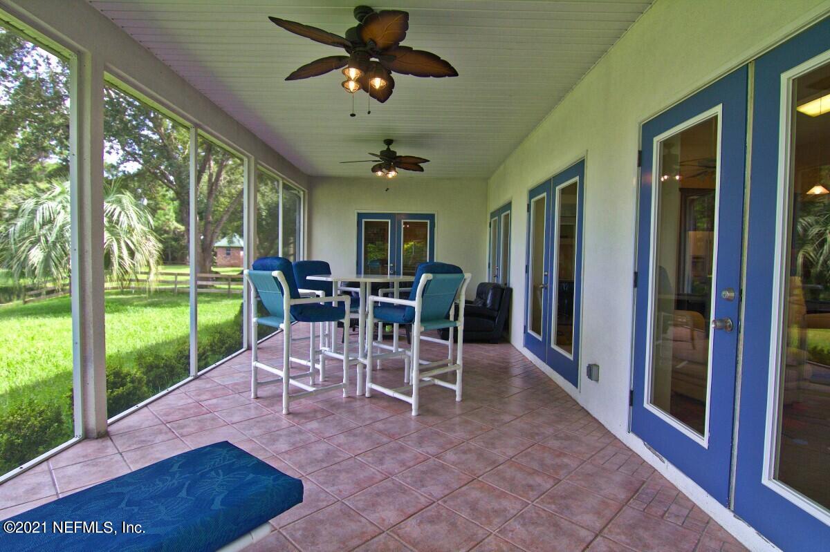 1365 Highway 206 St. Augustine, FL 32086 - Photo 22 of 54 a view of a dining room with furniture window and outside view
