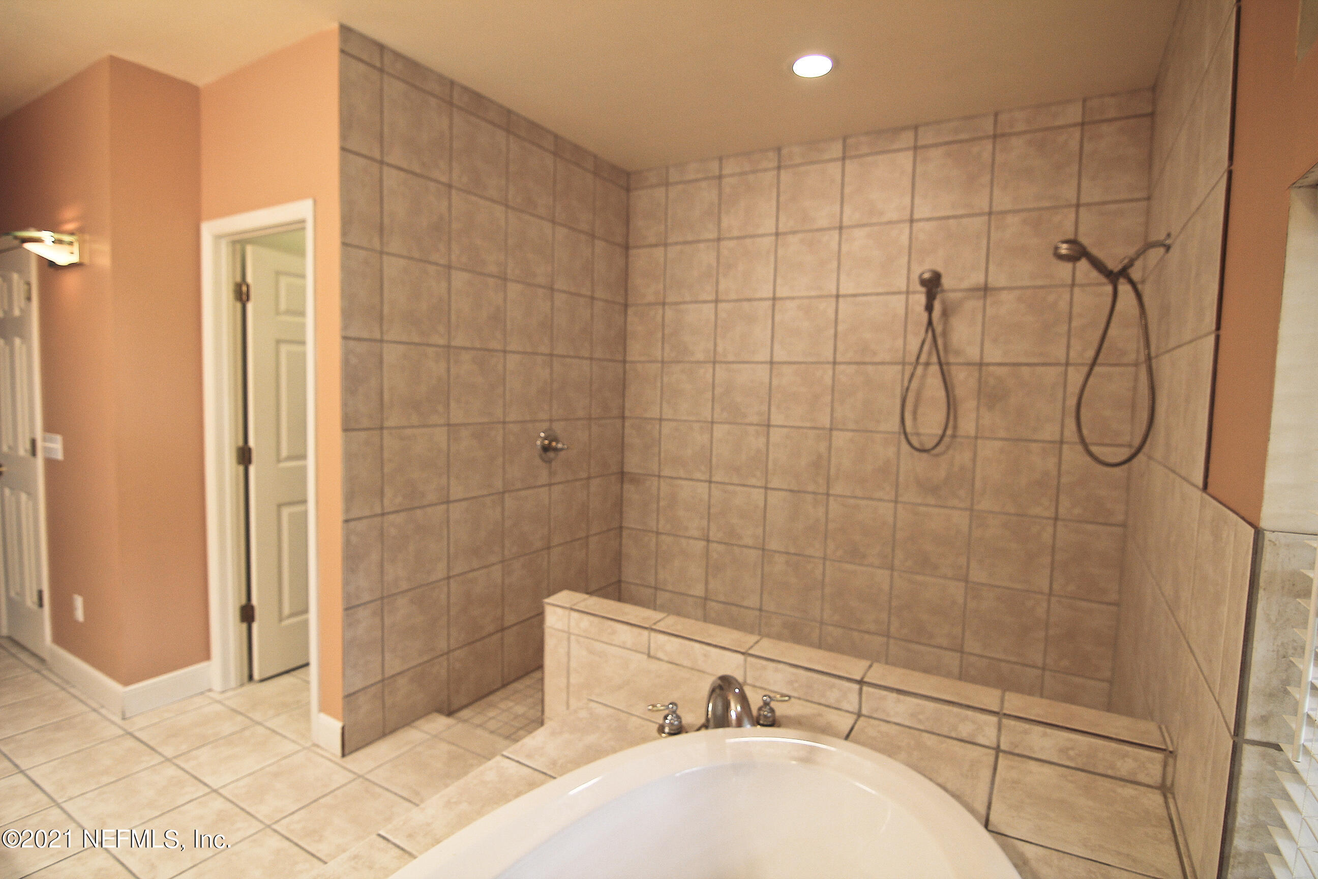 1365 Highway 206 St. Augustine, FL 32086 - Photo 29 of 54 a bathroom with a bathtub and shower