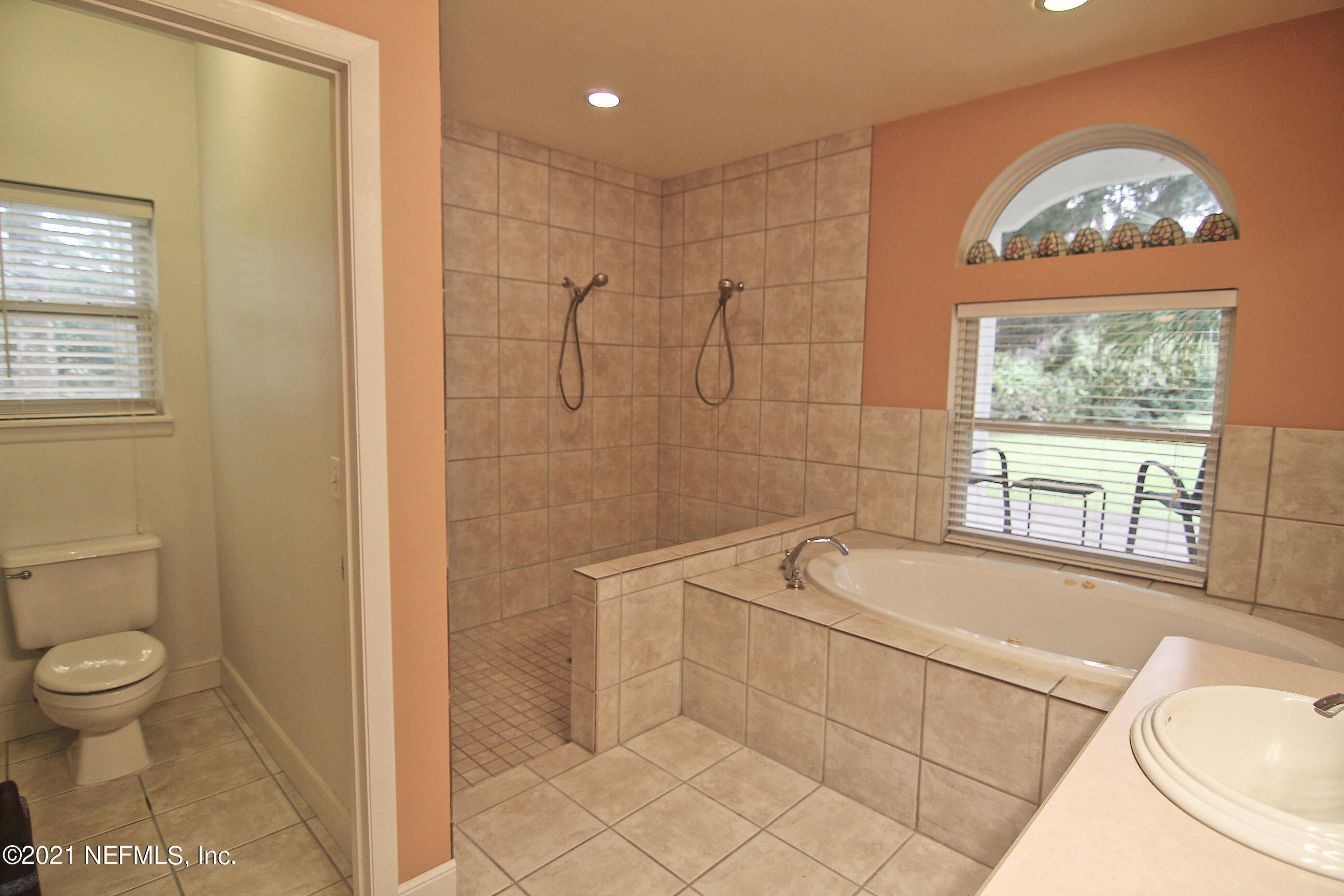 1365 Highway 206 St. Augustine, FL 32086 - Photo 30 of 54 a bathroom with a sink a toilet and tub