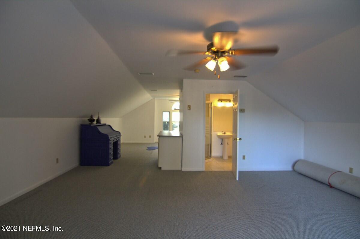 1365 Highway 206 St. Augustine, FL 32086 - Photo 38 of 54 a view of a living room with a flat screen tv