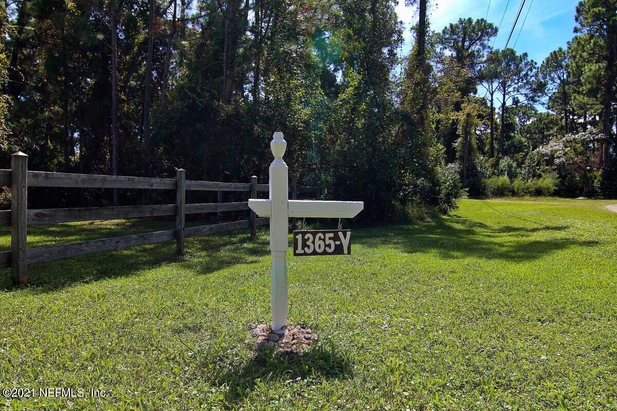 1365 Highway 206 St. Augustine, FL 32086 - Photo 4 of 54 a view of a garden with a bench