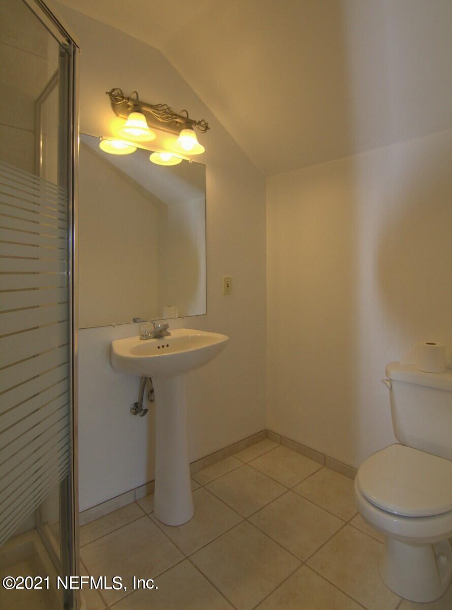 1365 Highway 206 St. Augustine, FL 32086 - Photo 41 of 54 a bathroom with a sink toilet and mirror