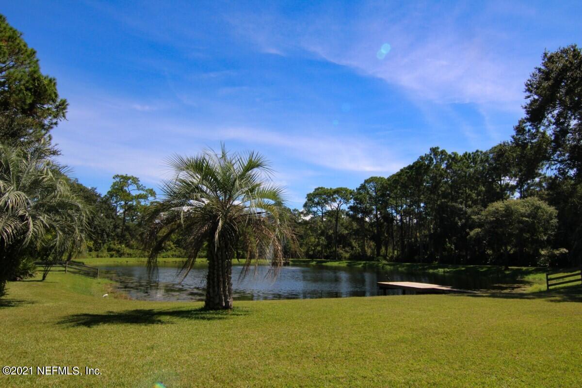 1365 Highway 206 St. Augustine, FL 32086 - Photo 46 of 54 a view of a swimming pool with a yard