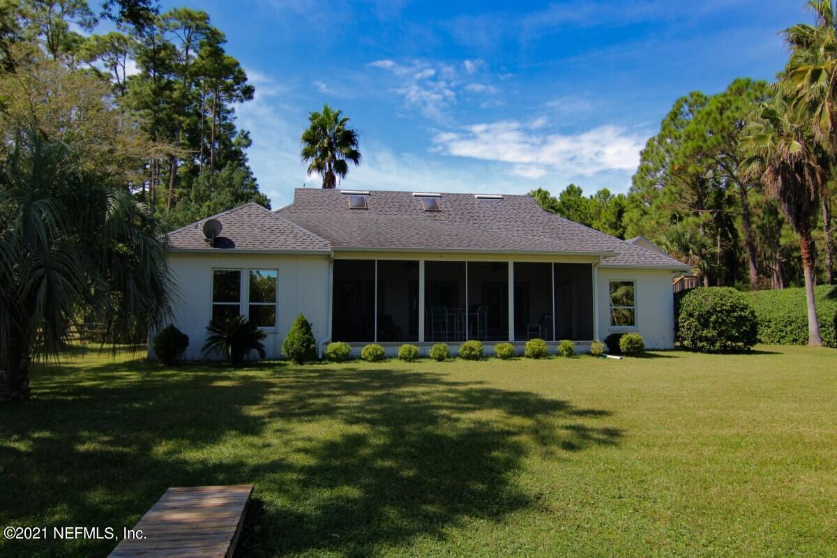 1365 Highway 206 St. Augustine, FL 32086 - Photo 47 of 54 a front view of a house with a garden