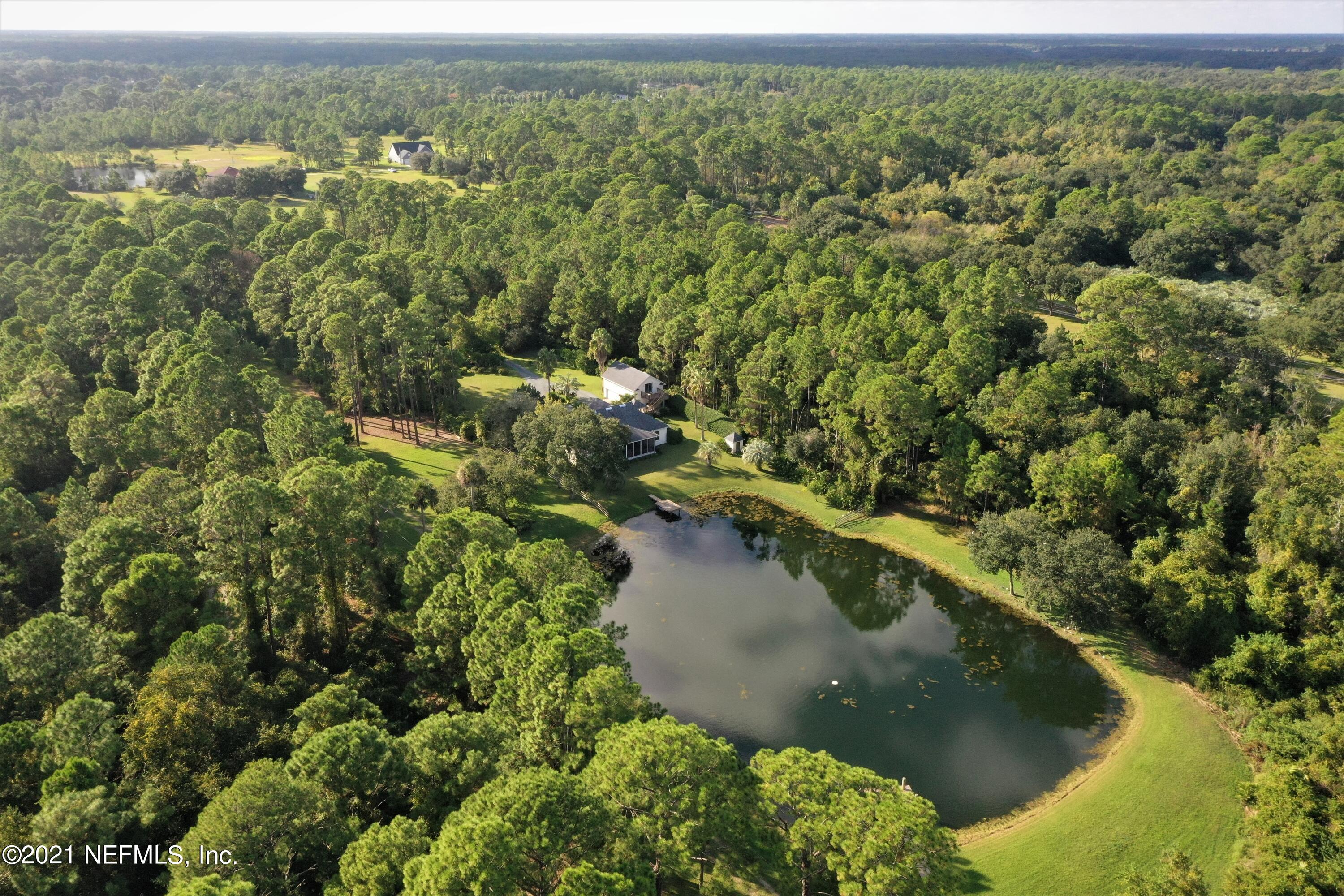 1365 Highway 206 St. Augustine, FL 32086 - Photo 53 of 54 an aerial view of a house with a yard and lake view