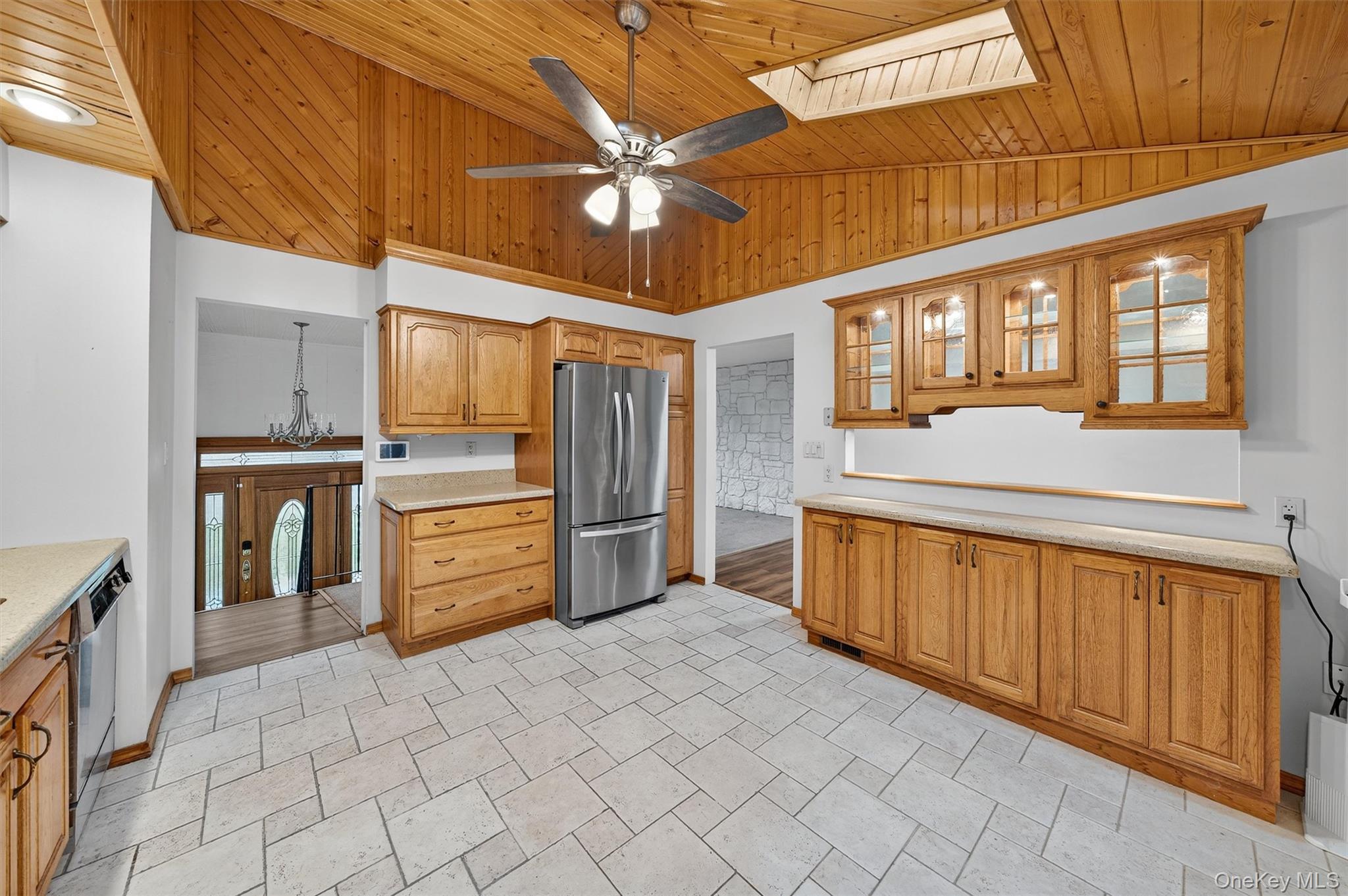 8 Badami Drive Middletown, NY 10941 - Photo 16 of 42 a kitchen with stainless steel appliances kitchen island granite countertop a refrigerator and cabinets