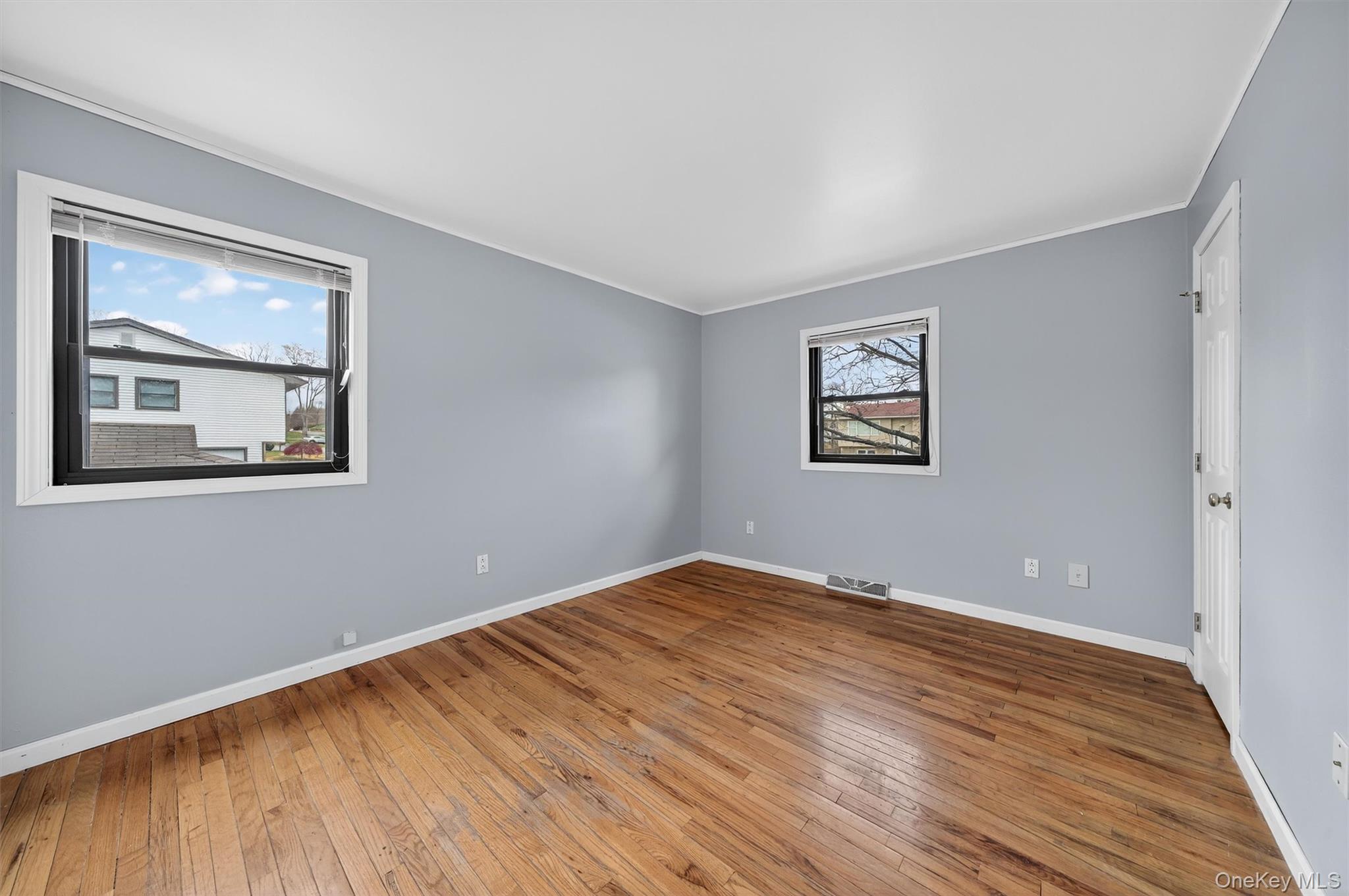 8 Badami Drive Middletown, NY 10941 - Photo 23 of 42 a view of an empty room with wooden floor and a window