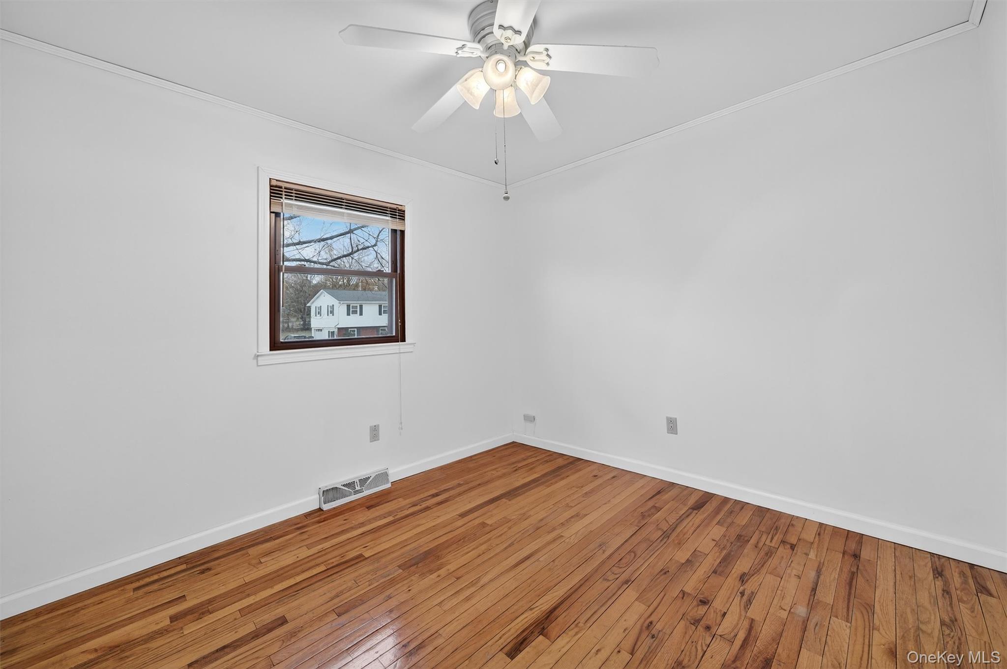 8 Badami Drive Middletown, NY 10941 - Photo 25 of 42 a view of a room with wooden floor and a ceiling fan