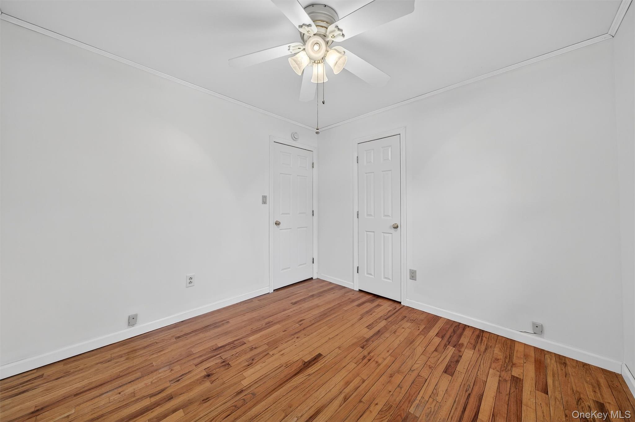 8 Badami Drive Middletown, NY 10941 - Photo 26 of 42 a view of a room with wooden floor and a chandelier fan