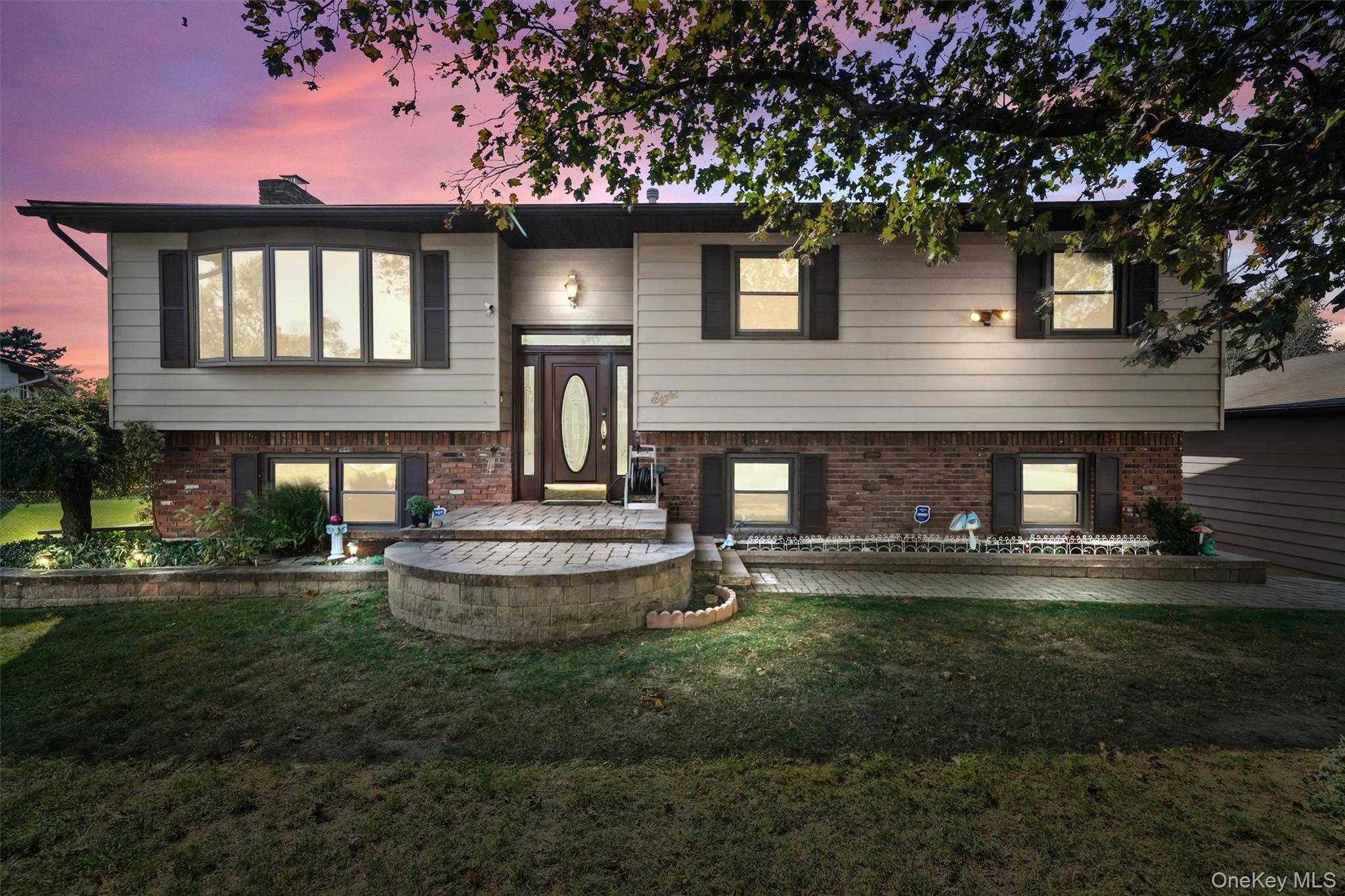 8 Badami Drive Middletown, NY 10941 - Photo 42 of 42 a front view of a house with a garden and yard