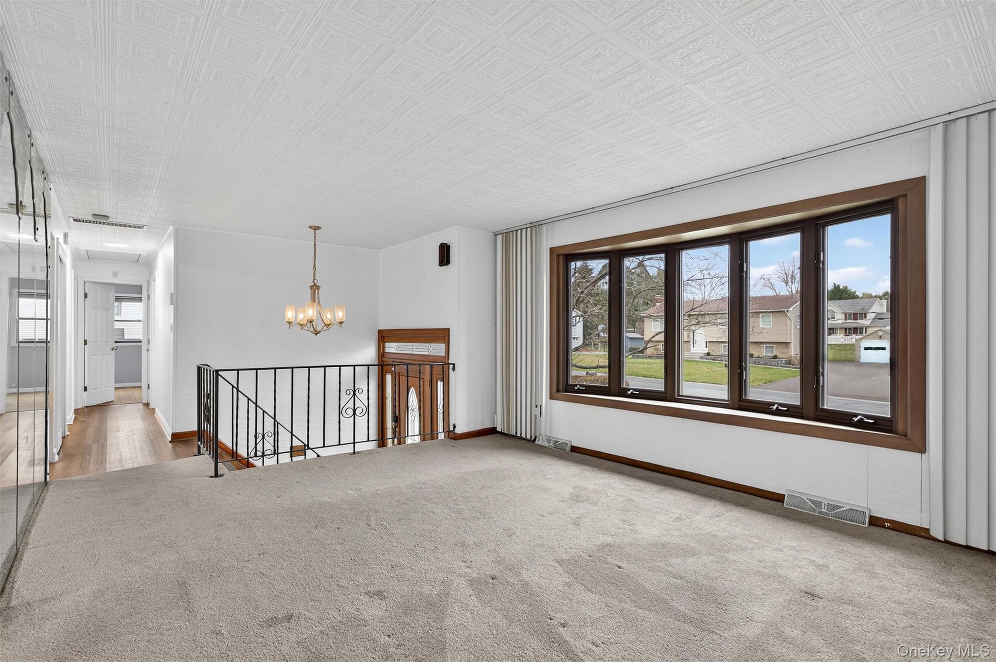8 Badami Drive Middletown, NY 10941 - Photo 7 of 42 a view of an empty room with a fireplace and a large window