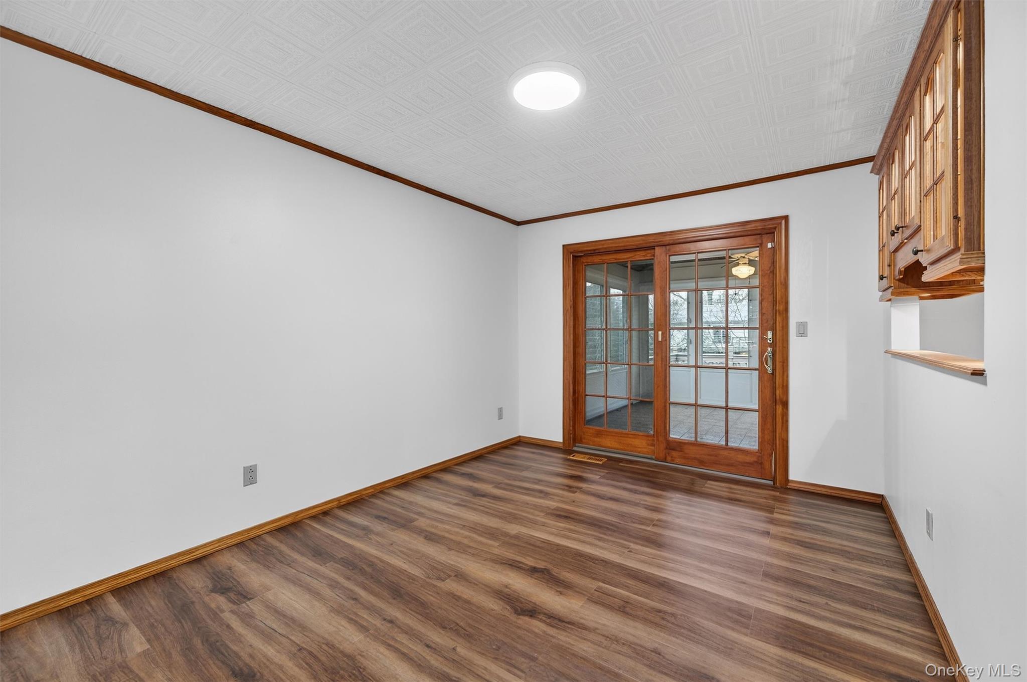 8 Badami Drive Middletown, NY 10941 - Photo 9 of 42 a view of an empty room with wooden floor and a window