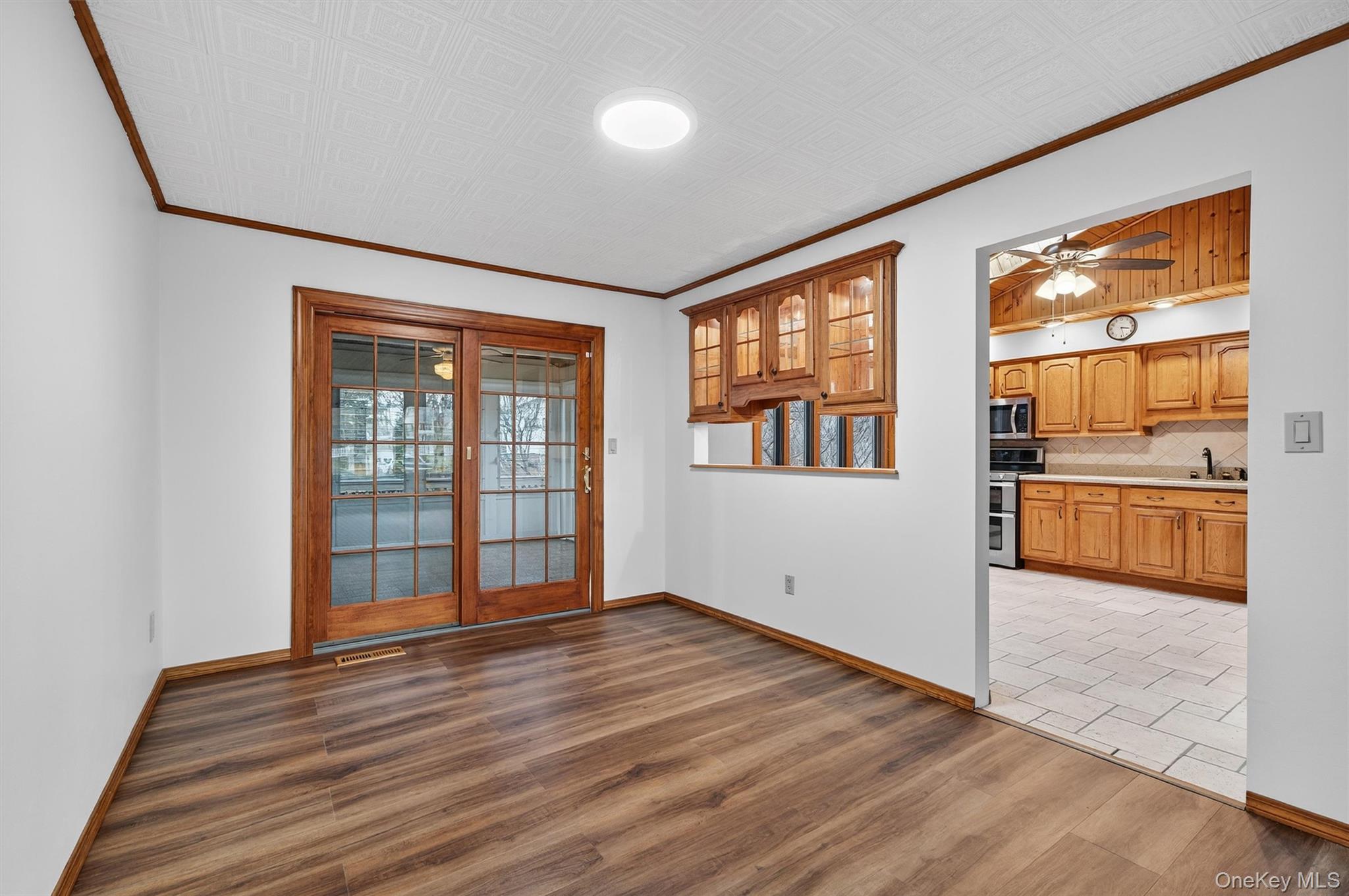 8 Badami Drive Middletown, NY 10941 - Photo 10 of 42 a view of an empty room with a window and wooden floor