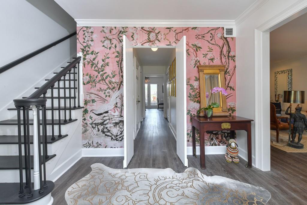 Foyer features Chinoiseries removable wallpaper.