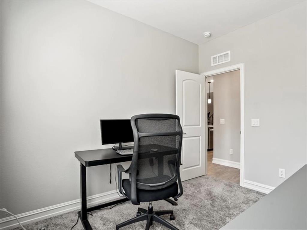 4828 Nicola Road Dallas, TX 75228 - Photo 17 of 38 a view of a workspace with furniture and a window