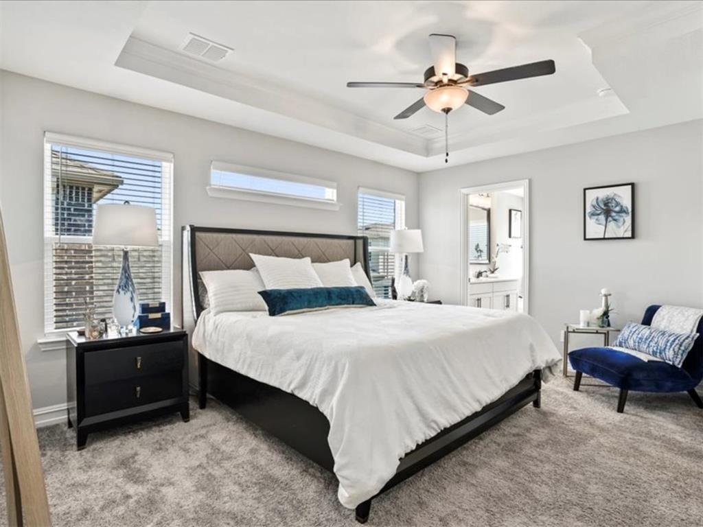 4828 Nicola Road Dallas, TX 75228 - Photo 21 of 38 a bedroom with a bed and ceiling fan