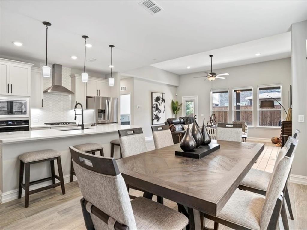 4828 Nicola Road Dallas, TX 75228 - Photo 6 of 38 a kitchen with a dining table chairs and view living room