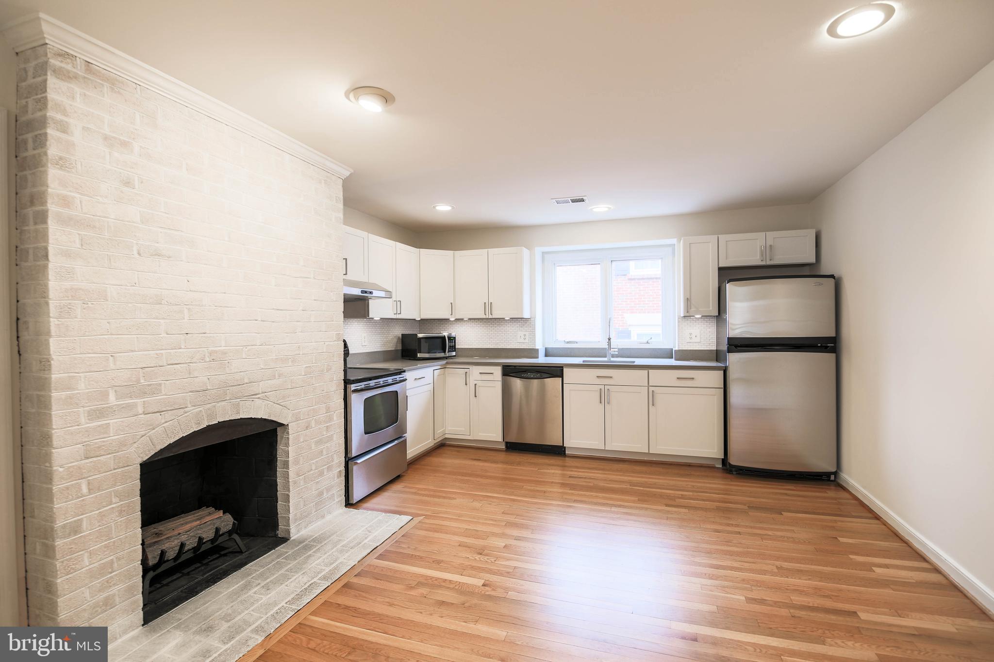 1243 Portner Road Alexandria, VA 22314 - Photo 13 of 53 A second wood-burning fireplace is in the kitchen