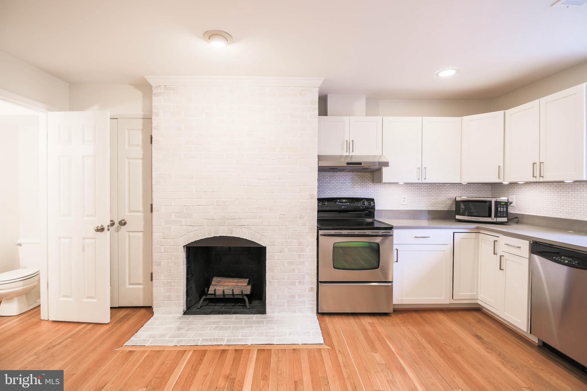 1243 Portner Road Alexandria, VA 22314 - Photo 14 of 53 Half bath located off kitchen (on left)