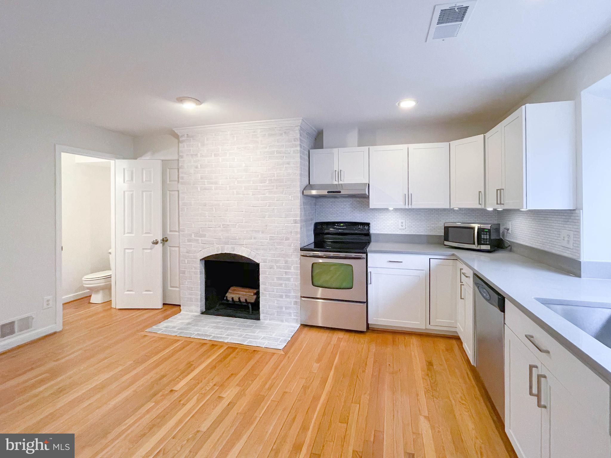 1243 Portner Road Alexandria, VA 22314 - Photo 22 of 53 Renovated half bath located on left of fireplace