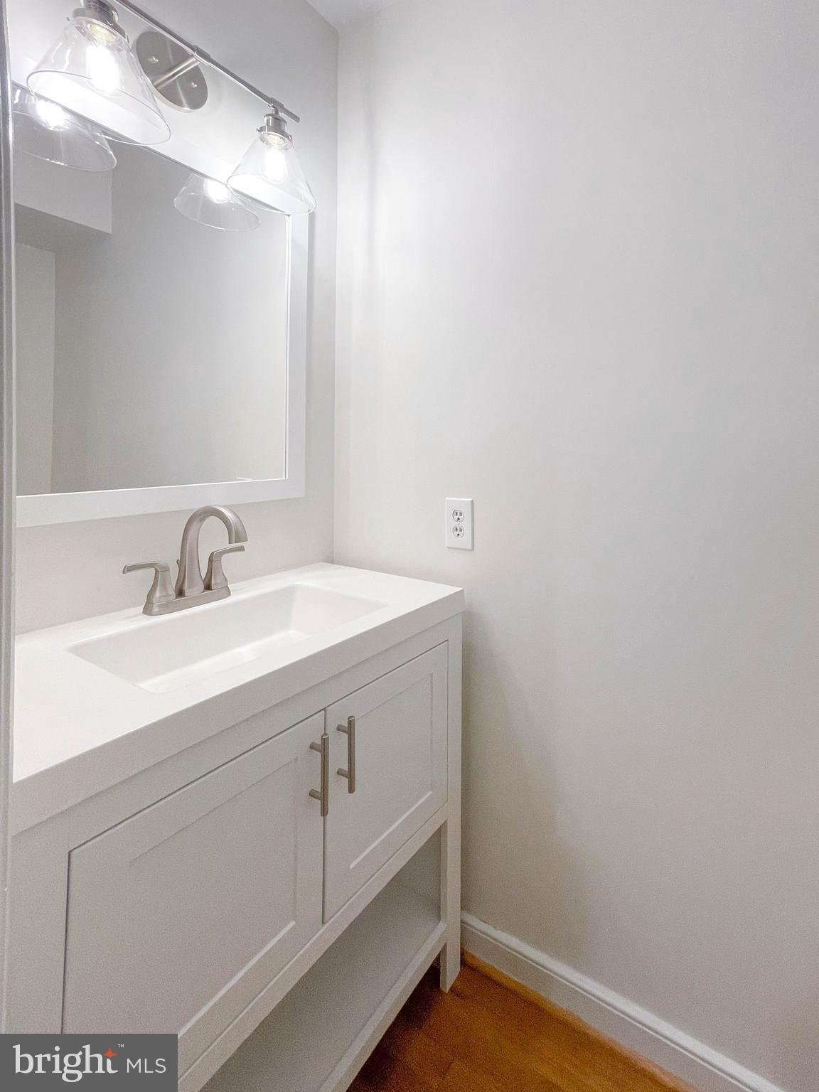 1243 Portner Road Alexandria, VA 22314 - Photo 23 of 53 Half bath with new vanity and lighting
