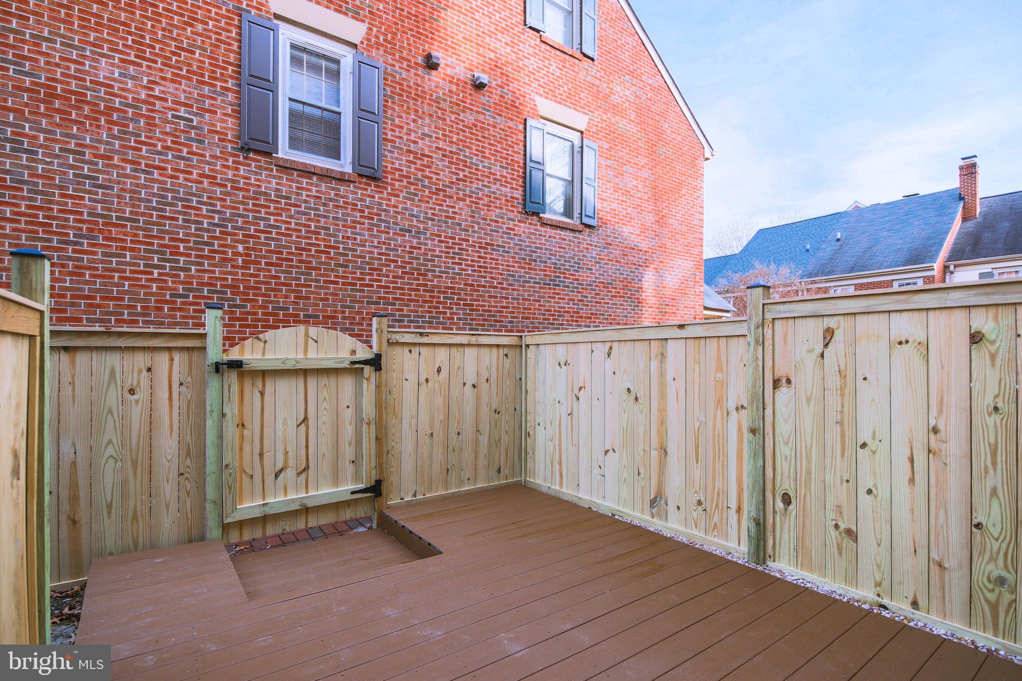 1243 Portner Road Alexandria, VA 22314 - Photo 50 of 53 The gate leads to the community parking area
